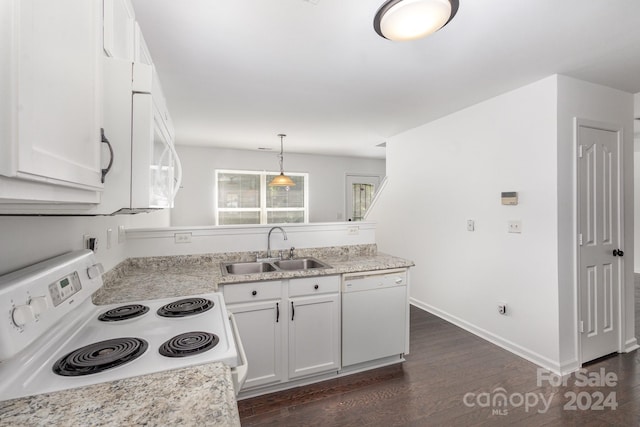 kitchen featuring dark wood-type flooring, sink, white appliances, and white cabinets