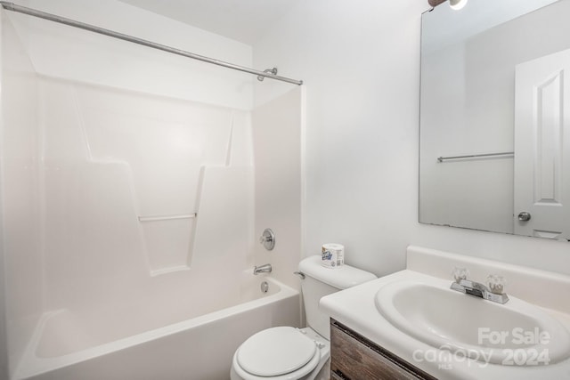 full bathroom featuring toilet, bathing tub / shower combination, and vanity