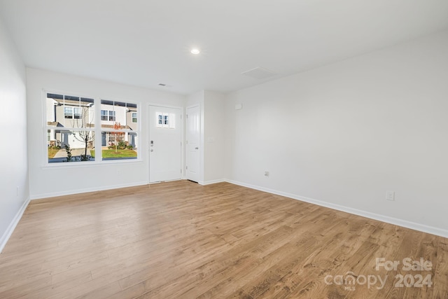 unfurnished room with light hardwood / wood-style flooring