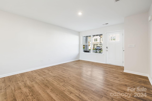 empty room featuring wood-type flooring