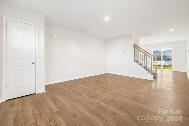 unfurnished room featuring wood-type flooring