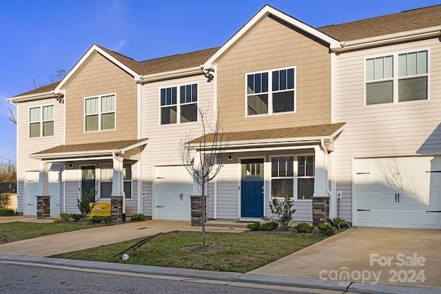 multi unit property featuring a garage