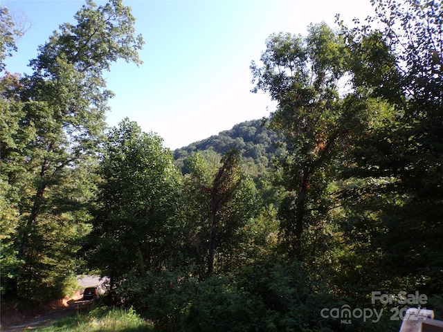 view of landscape with a view of trees