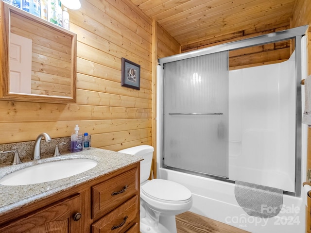 full bath featuring toilet, wood ceiling, enclosed tub / shower combo, vanity, and wood walls