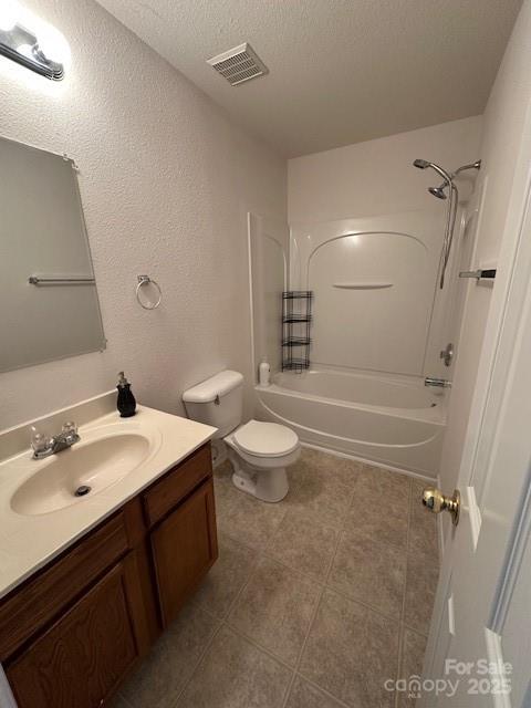 full bathroom featuring shower / bath combination, visible vents, toilet, vanity, and a textured ceiling