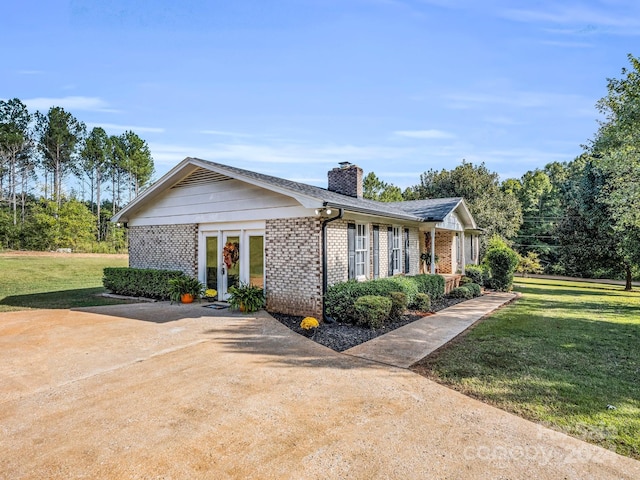 241 Eastview Dr, Bostic, NC 28018 - view of front of property with brick siding, a chimney, and a front yard