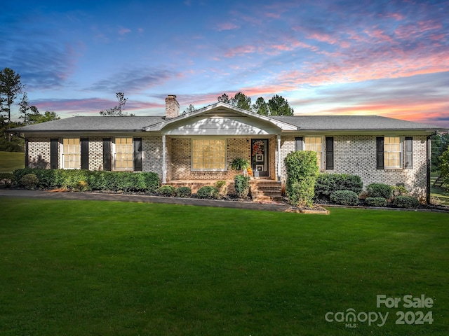 241 Eastview Dr, Bostic, NC 28018 - ranch-style home with a chimney, brick siding, and a yard