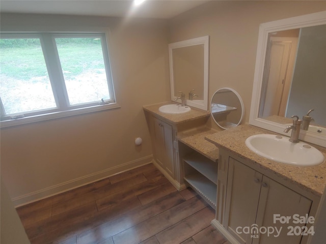 bathroom with vanity and hardwood / wood-style flooring