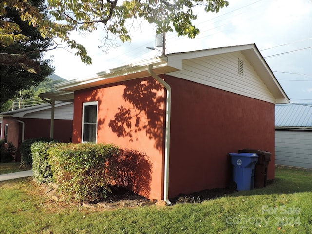 1555 Soco Rd Unit 6, Maggie Valley, NC 28751 - view of side of home featuring a yard and stucco siding
