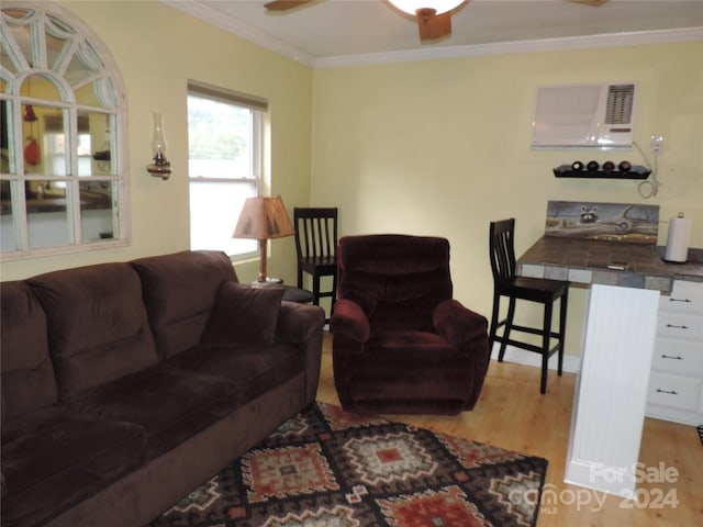 1555 Soco Rd Unit 6, Maggie Valley, NC 28751 - living area with ornamental molding, an AC wall unit, and light wood-style flooring