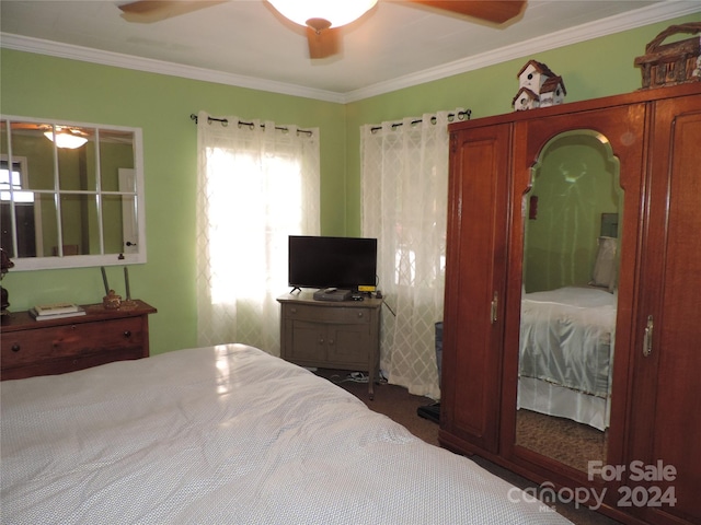 1555 Soco Rd Unit 6, Maggie Valley, NC 28751 - bedroom with ornamental molding, dark colored carpet, and ceiling fan