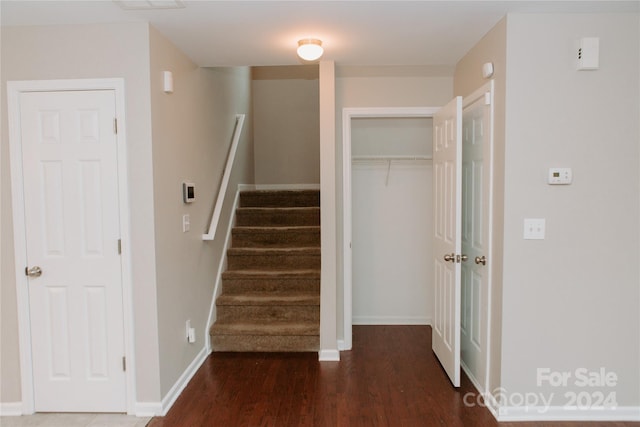 stairs featuring hardwood / wood-style flooring