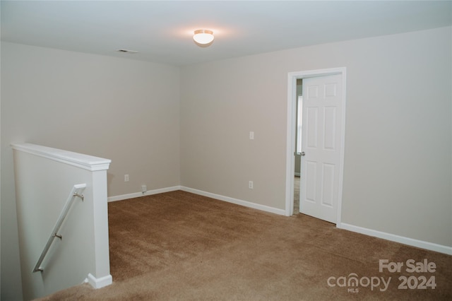 spare room with carpet