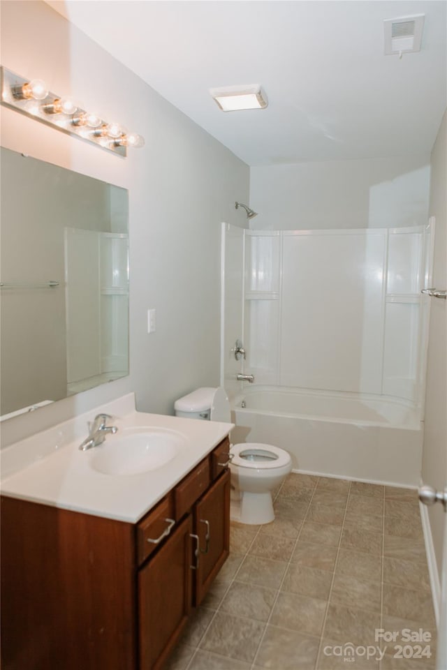 full bathroom featuring shower / bathing tub combination, vanity, tile patterned flooring, and toilet