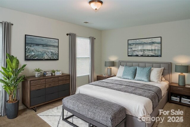 bedroom with carpet floors and visible vents