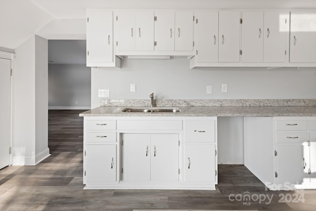 kitchen featuring sink, dark hardwood / wood-style floors, and white cabinets