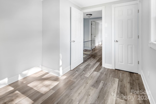 unfurnished room featuring light wood-type flooring