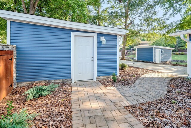 view of shed with fence