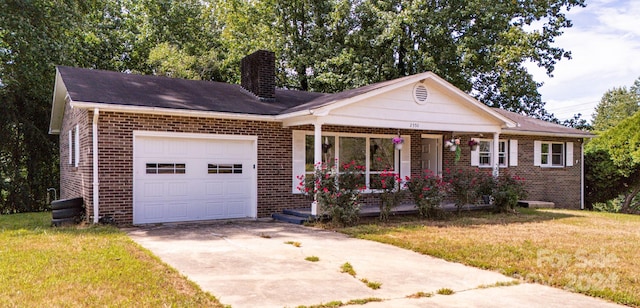 ranch-style home with a front yard, a garage, and a porch