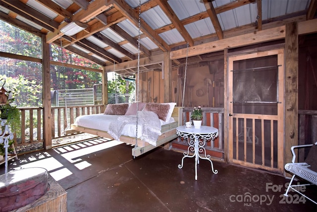 sunroom / solarium with vaulted ceiling