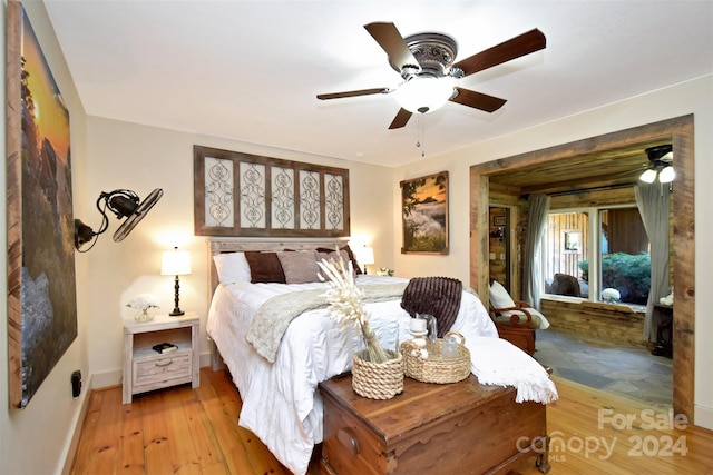 bedroom with light wood-type flooring and ceiling fan