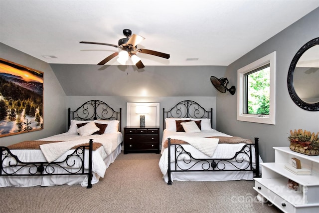 bedroom with lofted ceiling, ceiling fan, and light colored carpet