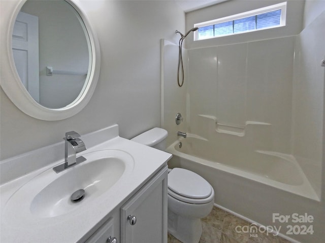 bathroom with shower / tub combination, vanity, and toilet