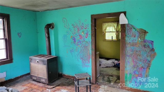 misc room with a wood stove