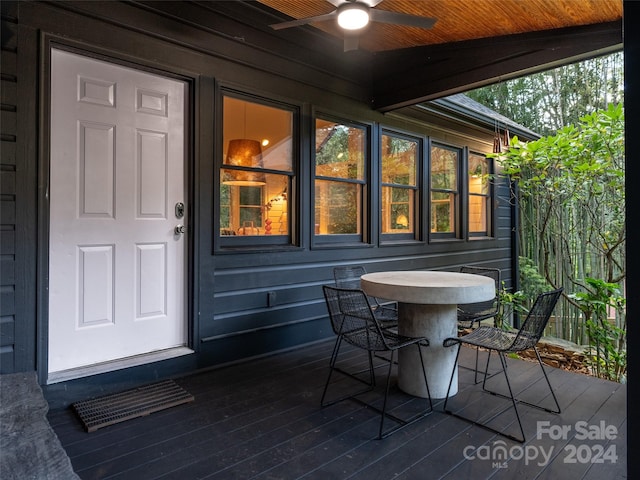 exterior space featuring ceiling fan and a deck