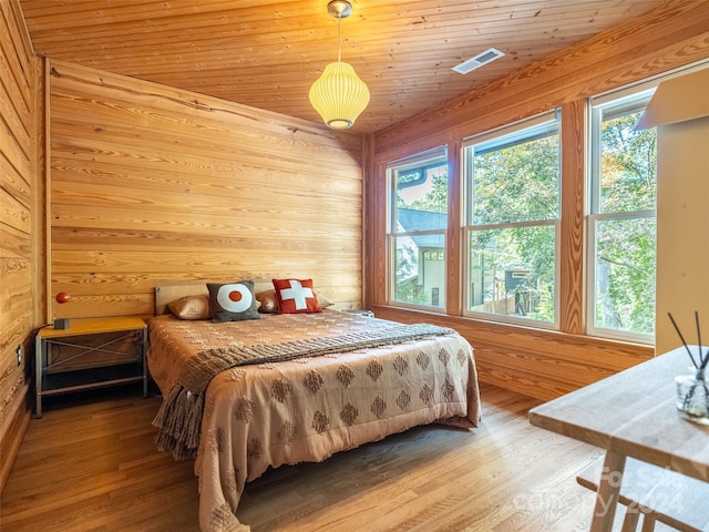 bedroom featuring wood ceiling and hardwood / wood-style flooring