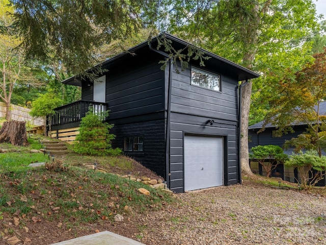 view of property exterior with a garage