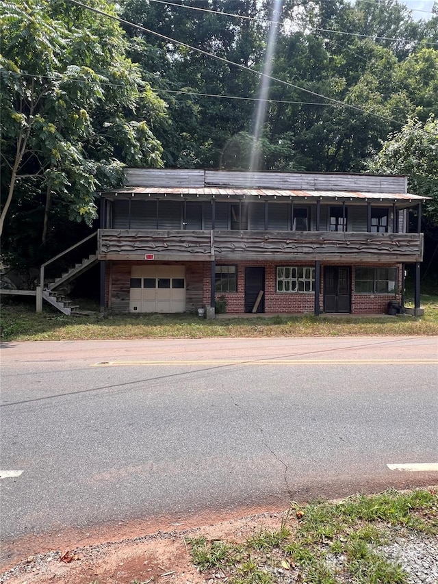 view of front of house featuring brick siding