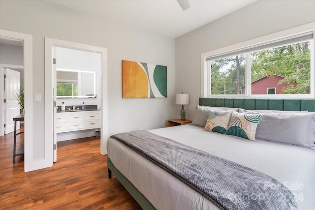 bedroom featuring multiple windows, dark hardwood / wood-style flooring, and ceiling fan