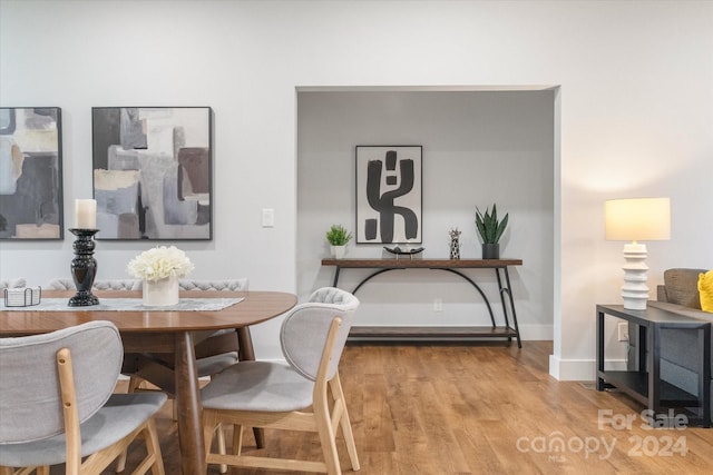 dining space with light wood-type flooring