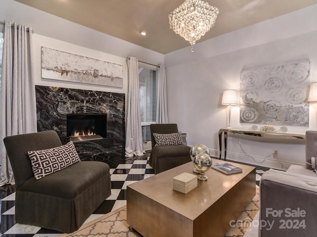 living room with tile patterned floors, a notable chandelier, and a premium fireplace