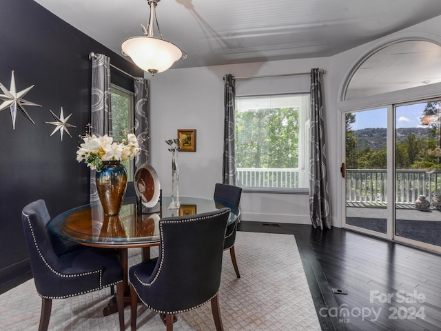 dining room with dark wood-type flooring