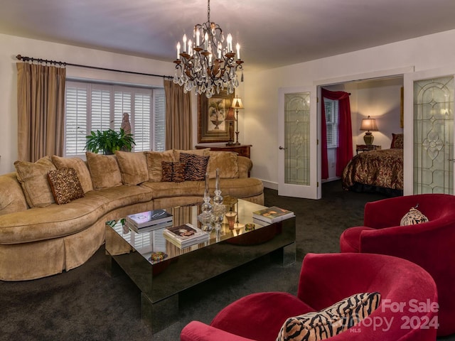 living room featuring a chandelier and carpet floors