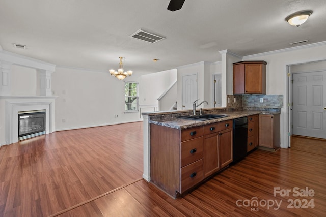 kitchen featuring crown molding, dark hardwood / wood-style flooring, sink, black dishwasher, and kitchen peninsula