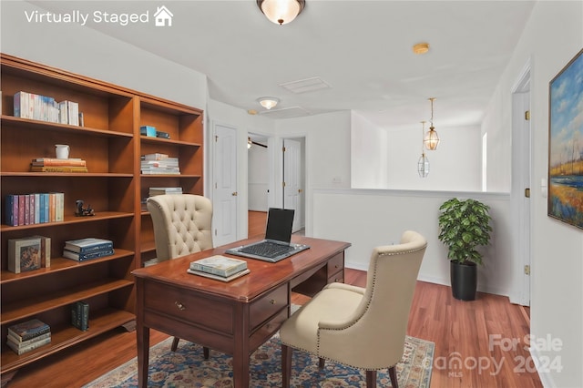 office with wood-type flooring