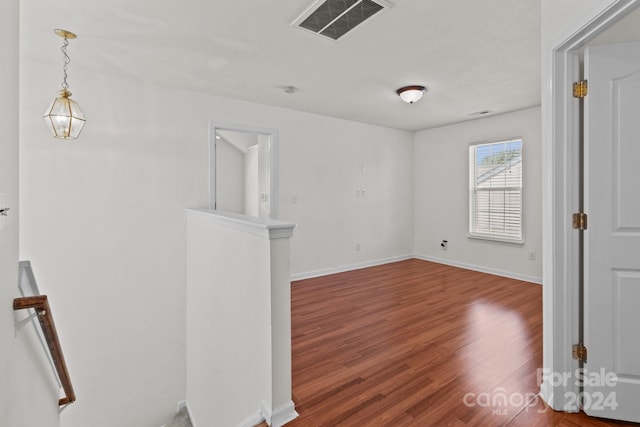 empty room featuring wood-type flooring