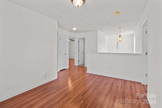 unfurnished room featuring hardwood / wood-style flooring