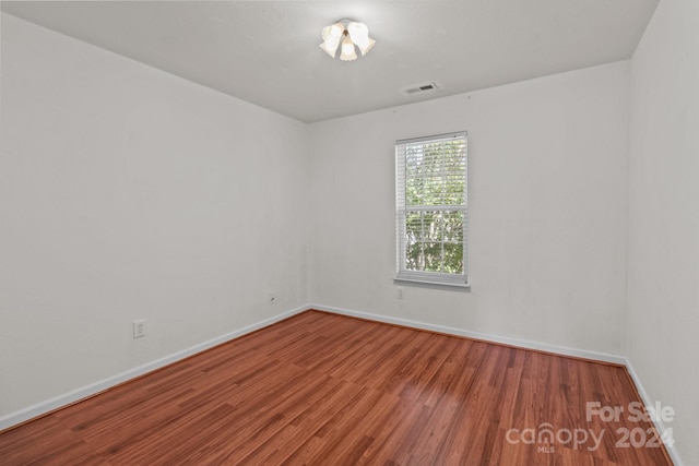 empty room featuring hardwood / wood-style floors