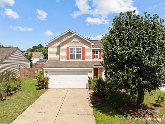 view of front of property with a front yard and a garage