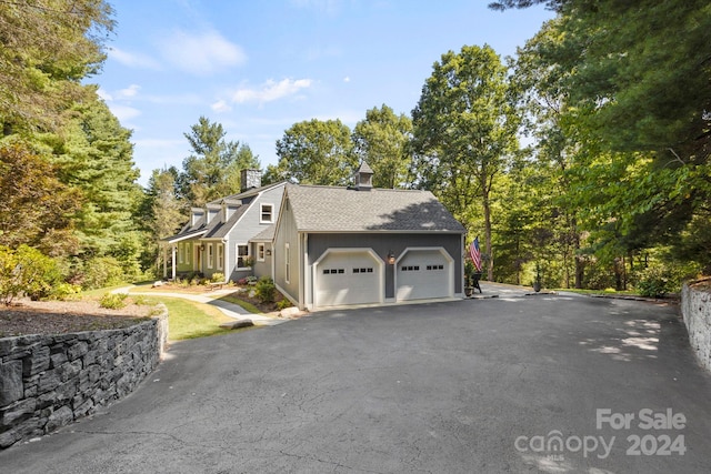 front of property with a garage