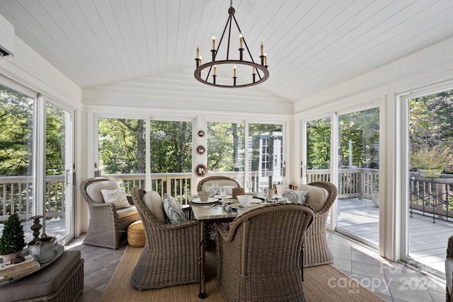 sunroom / solarium featuring wooden ceiling, a notable chandelier, and vaulted ceiling