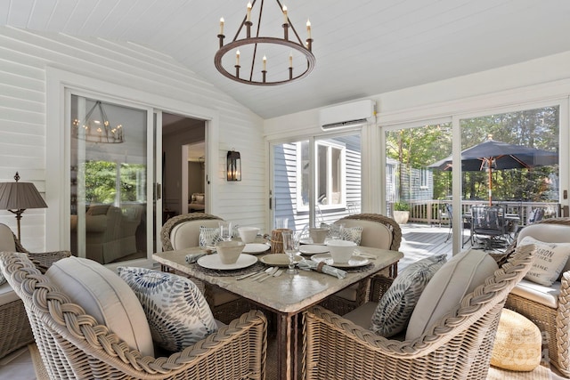 sunroom / solarium with lofted ceiling, wood ceiling, a wall unit AC, and an inviting chandelier