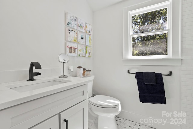 bathroom with tile patterned floors, toilet, and vanity