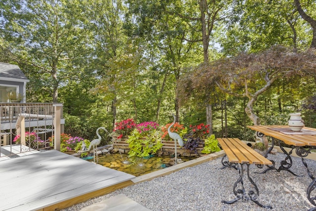 view of yard with a wooden deck and a patio area