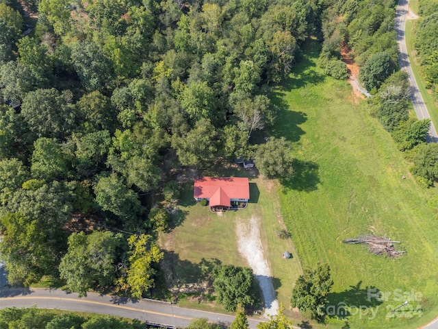 birds eye view of property with a rural view