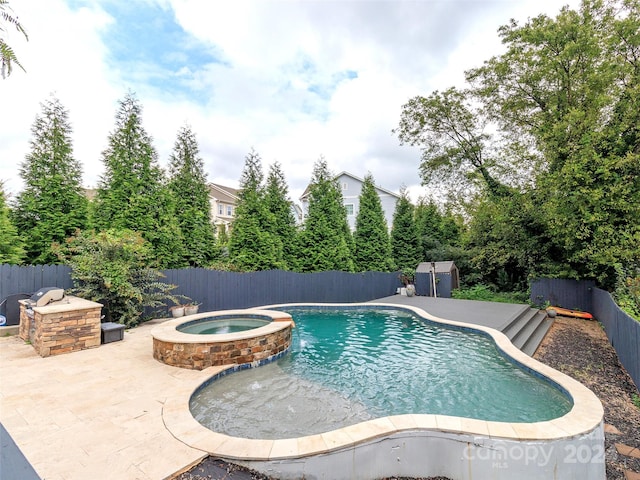 view of swimming pool with a patio and an in ground hot tub